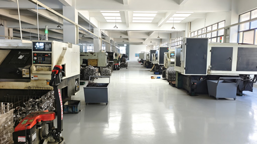 Modern manufacturing facility interior, industrial equipment, clean factory floor, professional industrial photography